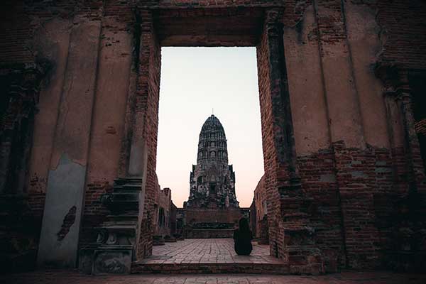 a-woman-sitting-alone-in-ancient-temple-in-ayuttha