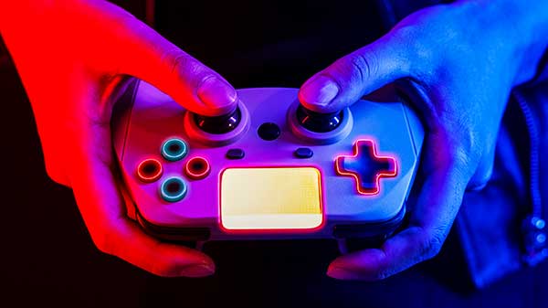 hand-playing-video-game-using-a-game-console