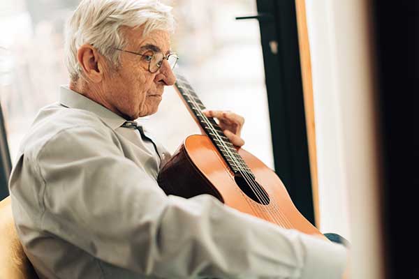 nostalgic-senior-man-playing-melodies