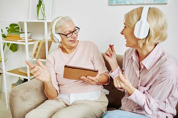 senior-women-listening-to-music-at-home