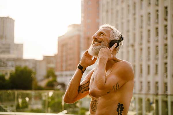 shirtless mature man listening music with headphon 2022 04 30 07 53 57 utc 1